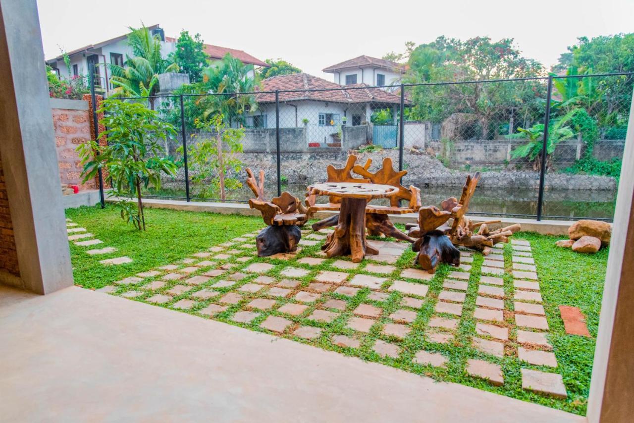 Negombo Boutique Villa Exterior foto A garden in Sri Lanka